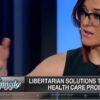 TV screen image of Lisa Kennedy Montgomery in dark green dress and eyeglasses hosting her show, looking to her right and gesturing, text on screen 'Kennedy' and 'Libertarian solutions to America's health care problems' and 'Fox Business' (color image)